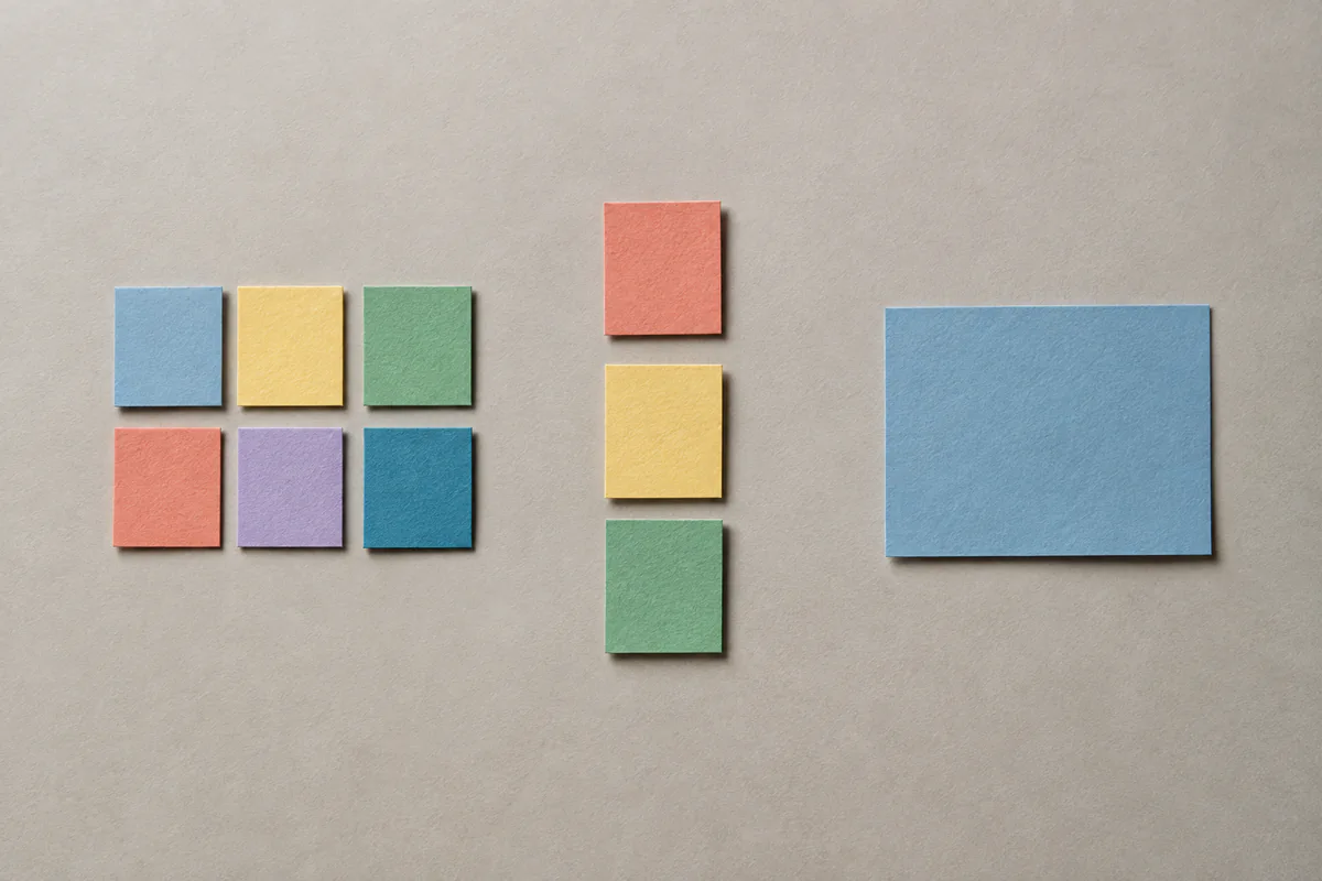 Colored paper pieces form a grid, a vertical list and a single block.