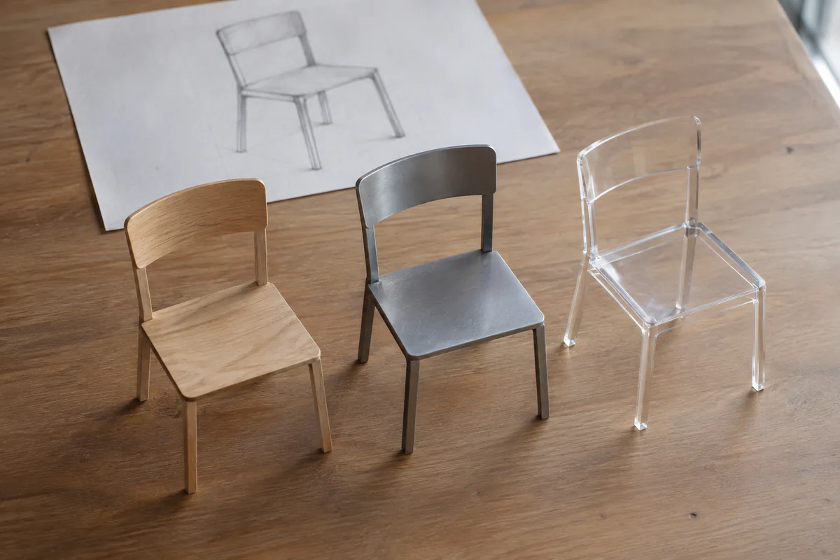 Three chair models vary in material while retaining the original form